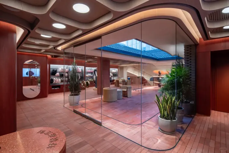 Glass-lined lululemon retail interior at Chengdu Taikoo Li with red tiled flooring