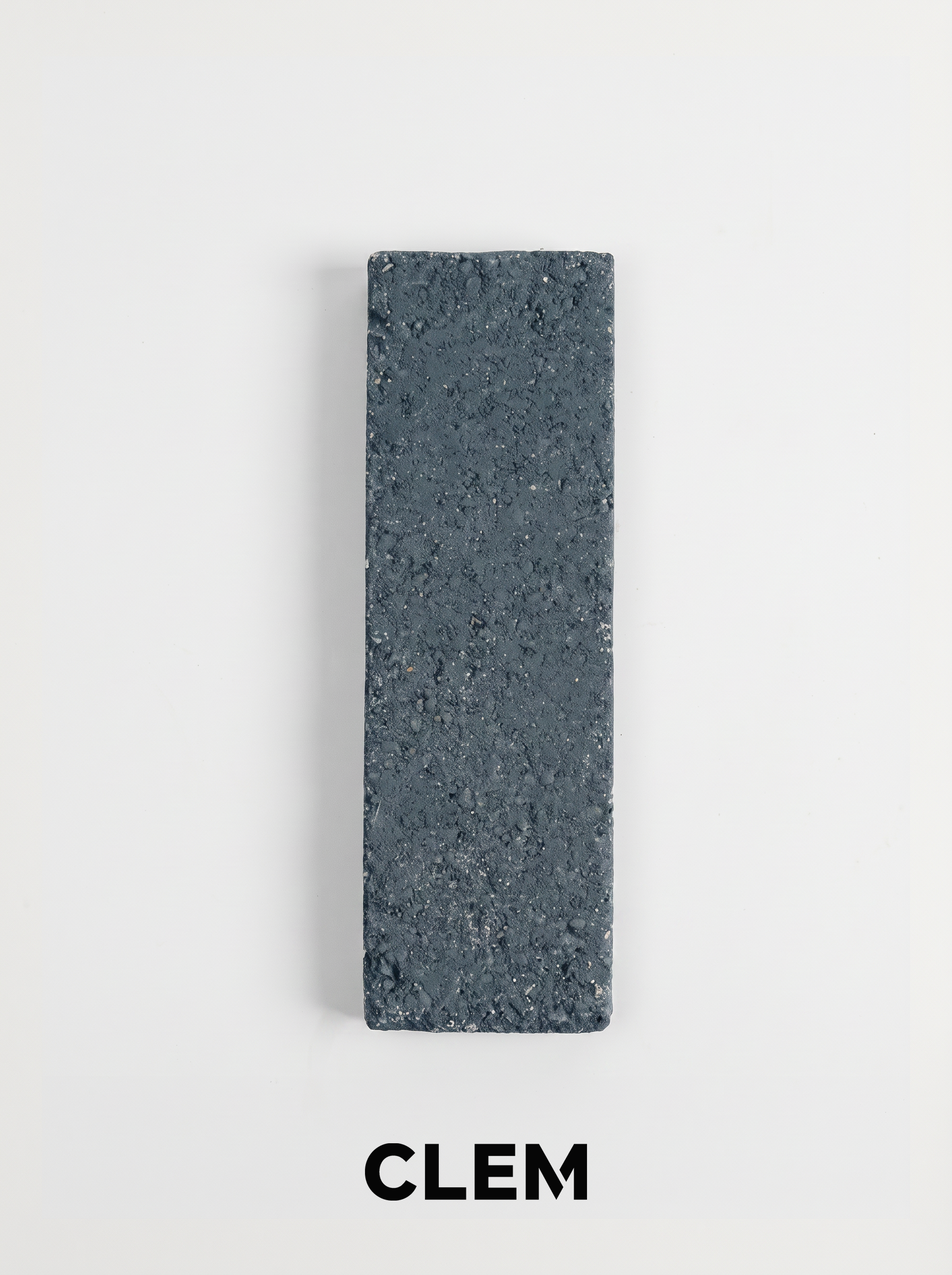 C09 Slate Blue recycled tile sample by CLEM Stone Tiles on a neutral background
