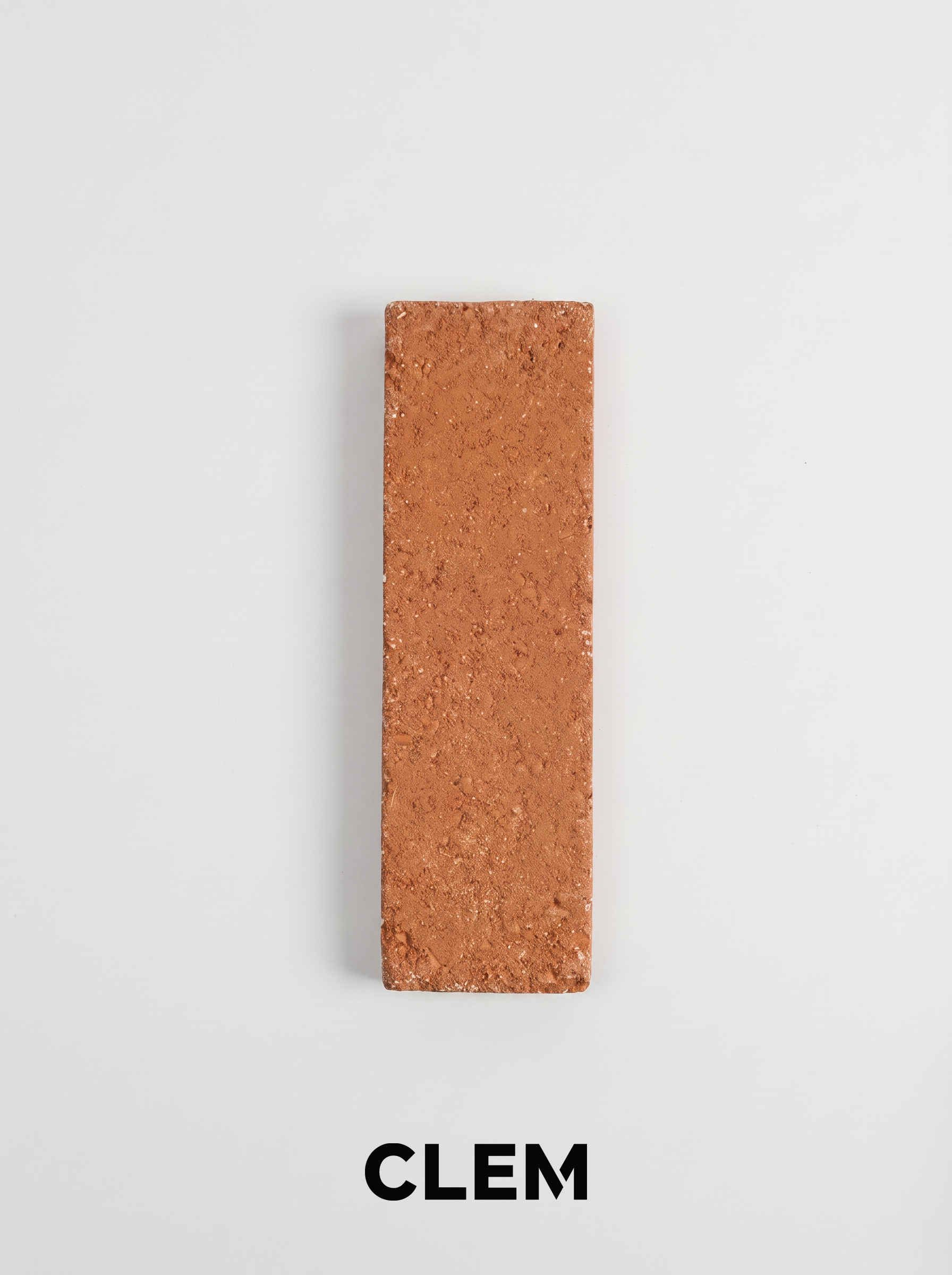 C11 Burnt Terracotta recycled tile sample by CLEM Stone Tiles on a neutral background