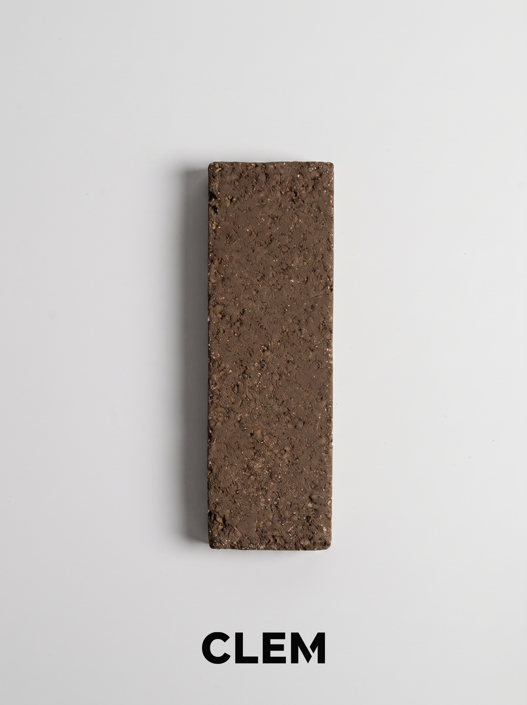 C14 Dark Umber recycled tile sample by CLEM Stone Tiles on a neutral background