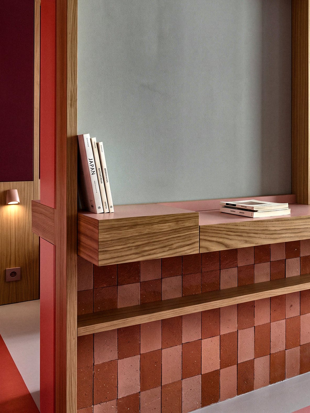 Crimson and blush CLEM tiles paired with warm timber